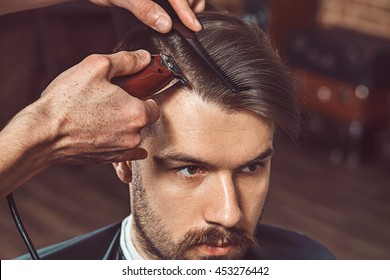 Hipster client visiting barber shop - Powered by Shutterstock