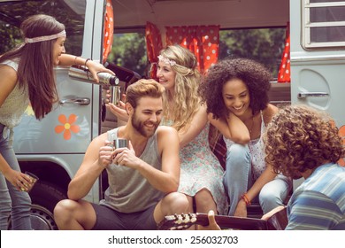 Hipster friends in camper van at festival on a summers day - Powered by Shutterstock