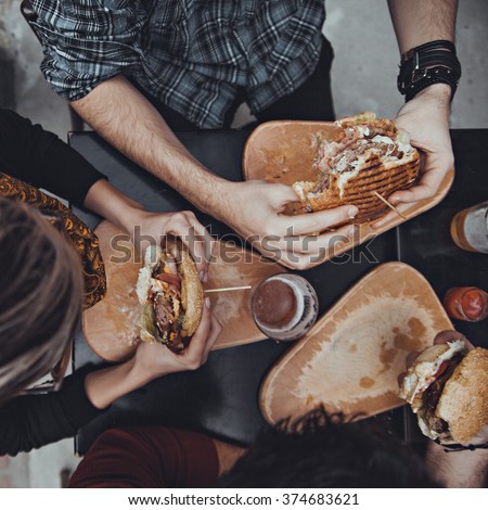 Similar – Mann hält Hot Dog im Barbecue mit Freunden.