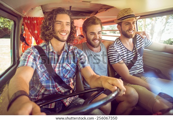Hipster friends on\
road trip on a summers\
day