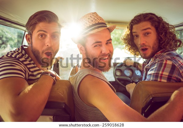 Hipster friends on
road trip on a summers
day