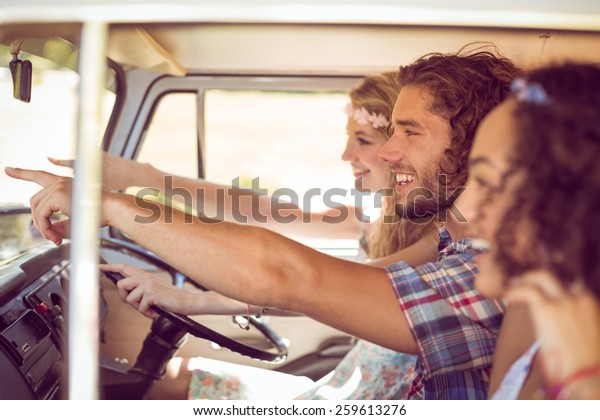 Hipster friends on\
road trip on a summers\
day