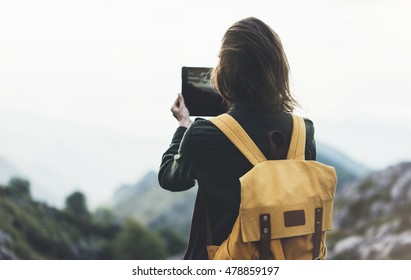 Hipster Girl With Backpack Enjoying Sunset On Peak Of Foggy Mountain, Tourist Traveler Taking Pictures Of Landscape On Mobile Sell Phone Camera On Background Valley View Mockup, Hiker Photographing 