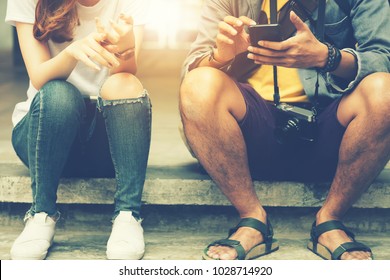 hipster girl and boy posing in the street with using smartphone, Their story, post in instagram, facebook