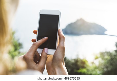 Hipster Girl Texting Message On Smartphone Mobile Close Up, View Tourist Hands Using Gadget Phone On Device Travel On Background Green Mountains Landscape; Finger Touch Blank Screen Cellphone Mockup