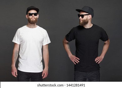 Hipster handsome male model with beard wearing black and white blank t-shirt and a baseball cap with space for your logo - Shutterstock ID 1441281491