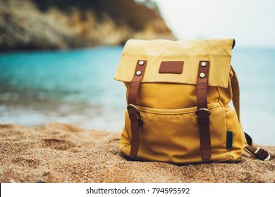 Hipster Hiker Tourist Yellow Backpack Closeup On Background Blue Sea Enjoying Sunset Ocean Horizon, Blurred Panoramic Seascape Sunrise, Traveler Relax Holiday Concept, Sunlight View In Trip Vacation