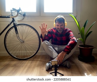  Hipster Latin Spanish Man Making A Video Call With A Smart Phone In An Apartment