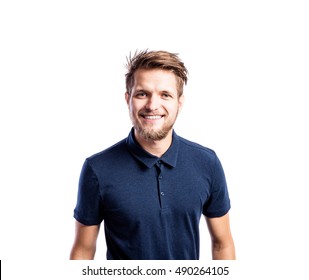 Hipster man in blue t-shirt, studio shot, isolated