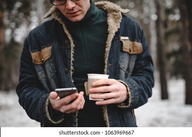 Hipster Man With Mobile Phone In His Hand Drink Coffee Outdoor. 