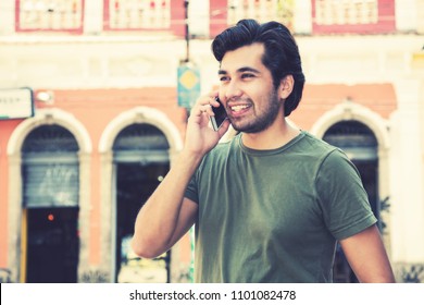 Hipster Man At Phone In Colonial Town In Vintage Retro Look