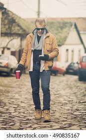 Hipster modern guy using cellphone.

