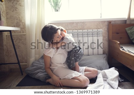 Similar – Little girl playing with boy over the bed