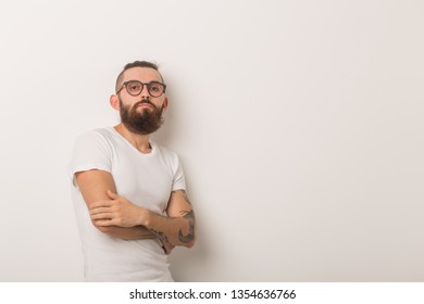 Hipster, People Concept - Hipster Guy Wearing Glasses With Arms Crossed On A White Background