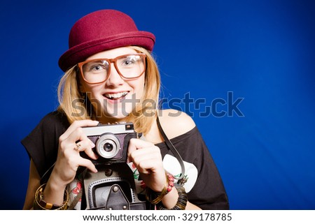 Hipster teenager girl with photo camera