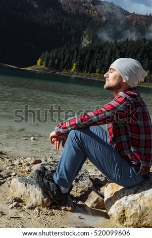 Similar – Entspannter Mann genießt die Natur an einem ruhigen See