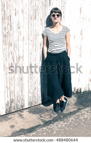 Similar – young beautiful lady posing in the living room next to a window