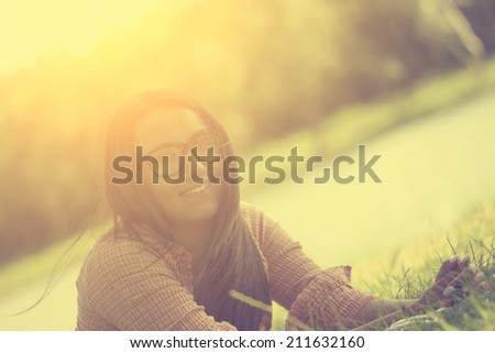 Hipster young girl relaxing on grass 