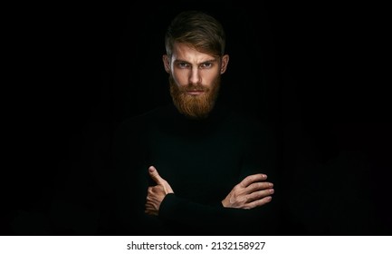 Hipster young man with folded and crossing hands standing Isolated on black background and looking at camera Hairstyle concept - Shutterstock ID 2132158927