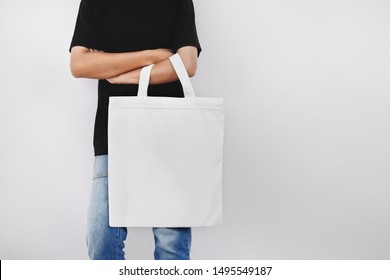 hipter woman holding eco fabric bag isolate on white background
