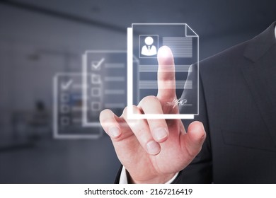 Hiring Employee And Human Resources Concept With Man Finger On Virtual Sensor Screen With Digital CV Or Resume