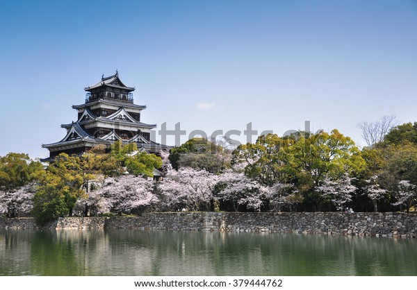 Hiroshima\
castle on the side of Otagawa river in\
spring