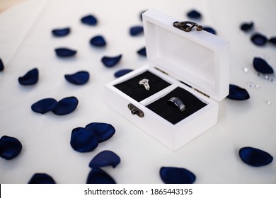 His And Hers Rings In A Display Case.