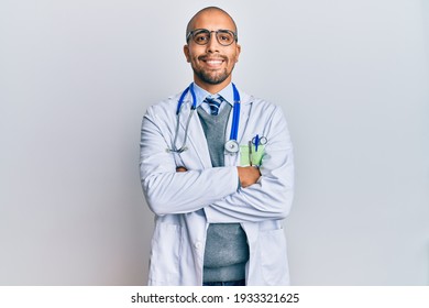 Hispanic Adult Man Wearing Doctor Uniform And Stethoscope Happy Face Smiling With Crossed Arms Looking At The Camera. Positive Person. 