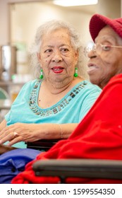 Hispanic And  African American Women Together At A Senior Center