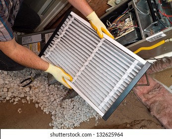 Hispanic Airconditioning Repair Man Performing Maintenance