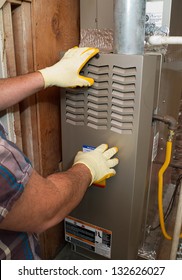 Hispanic Airconditioning Repair Man Performing Maintenance