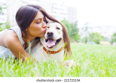 Hispanic Or Asian Cute Girl Kiss White Dog In Summeror Spring Green  Park On House Or Home And Sunny Sky Background Empty Copy Space For Inscription Woman With Long Brunette Hair Simbol Of Protection