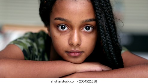 Hispanic Beautiful African descent teenager girl looking at camera - Powered by Shutterstock