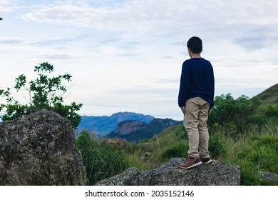 Hispanic Boy From Back Looking At The Landscape