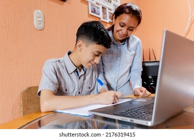 Hispanic Boy Studying From Home - Hispanic Mom Helping Her Son With Homework - Online Classes In Latin America