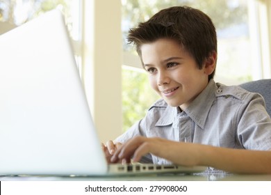 Hispanic Boy Using Laptop