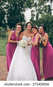 Hispanic Bride And Bridesmaids In Row