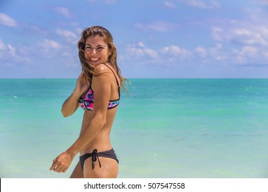 A hispanic brunette model enjoying the beach