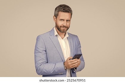 hispanic business man with phone. Business communication. Casual business man chatting on phone isolated on grey. Businessman using phone. Man phone conversation in studio. Instant message - Powered by Shutterstock