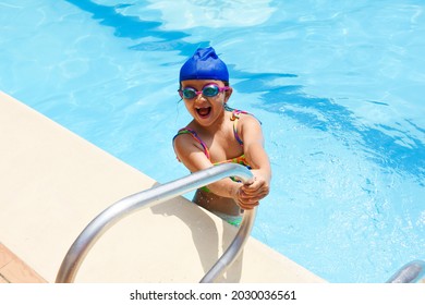 A Hispanic Child From Colombia Swimming In A Pool