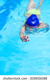 A Hispanic Child From Colombia Swimming In A Pool