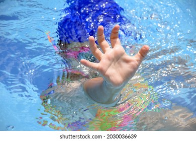 A Hispanic Child From Colombia Swimming In A Pool