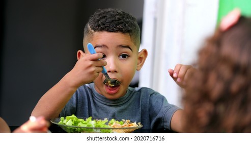 Hispanic Child Eating Lunch. South American Kids Eat Meal Salad