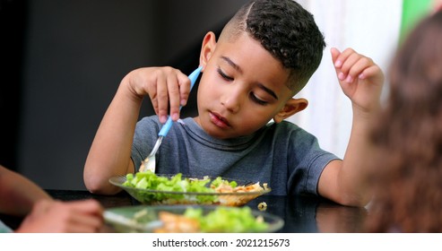 Hispanic Child Eating Lunch. South American Kids Eat Meal Salad