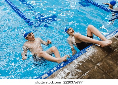 Hispanic Children Kids Swimmer Wearing Cap And Goggles In A Swimming Training At The Pool In Mexico Latin America