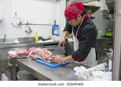 Hispanic Cook In Diner Kitchen