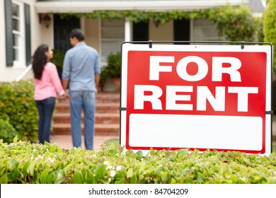 Hispanic Couple Outside Home For Rent