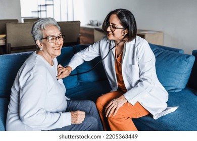 Hispanic Elderly Woman With Doctor Or Nurse During Home Visit In Mexico Latin America