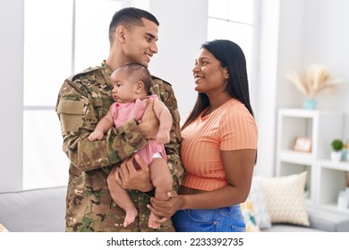 Hispanic family army soldier hugging each other at home - Powered by Shutterstock