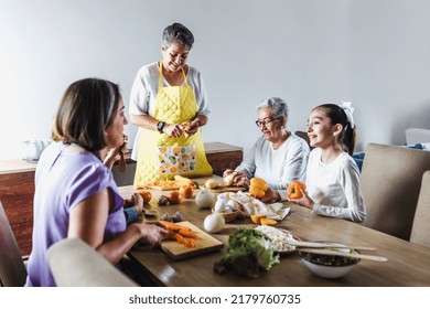 Hispanic Family Of Female Three Generations, Grandmother And Granddaughter Cooking At Home In Mexico Latin America